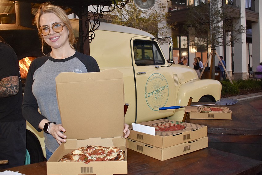 Shelley Wood packs up the pizzas to go from the Cornerstone & Co. food truck.