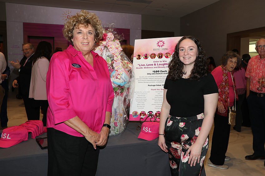 Deborah Croce and Grace Weichert sell raffle tickets at the Easter Seals Southwest Florida luncheon on March 5.