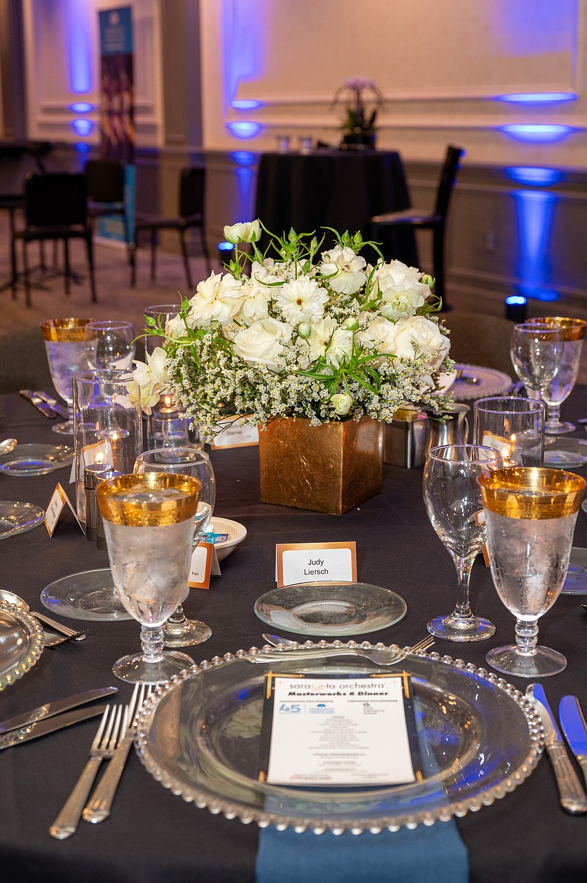 The tables featured an elegant setting for dinner.
