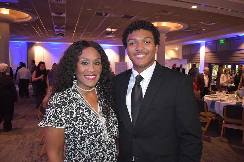 Nurisha Harvey and her son, high school senior Amari Lopez, a scholarship recipient