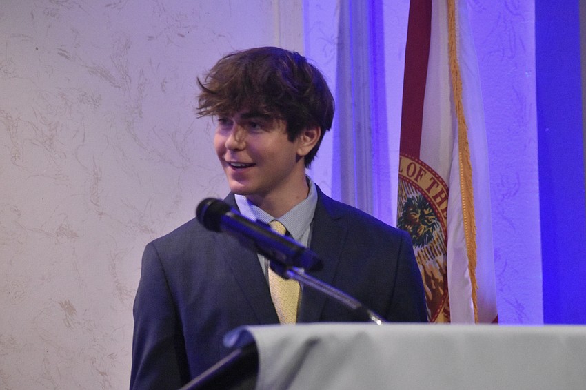 Senior Angus Kirby speaks at the podium.