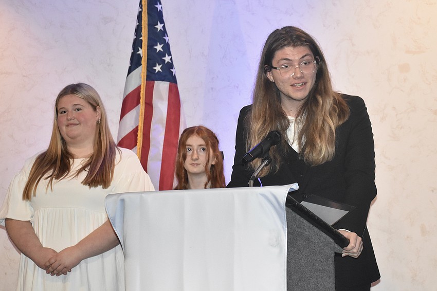 Seniors Layla Brownell, Emma Grimes and Shen Miller take to the podium. Miller was the recipient of the Lynne Strong award, which recognized exceptional service to the organization.