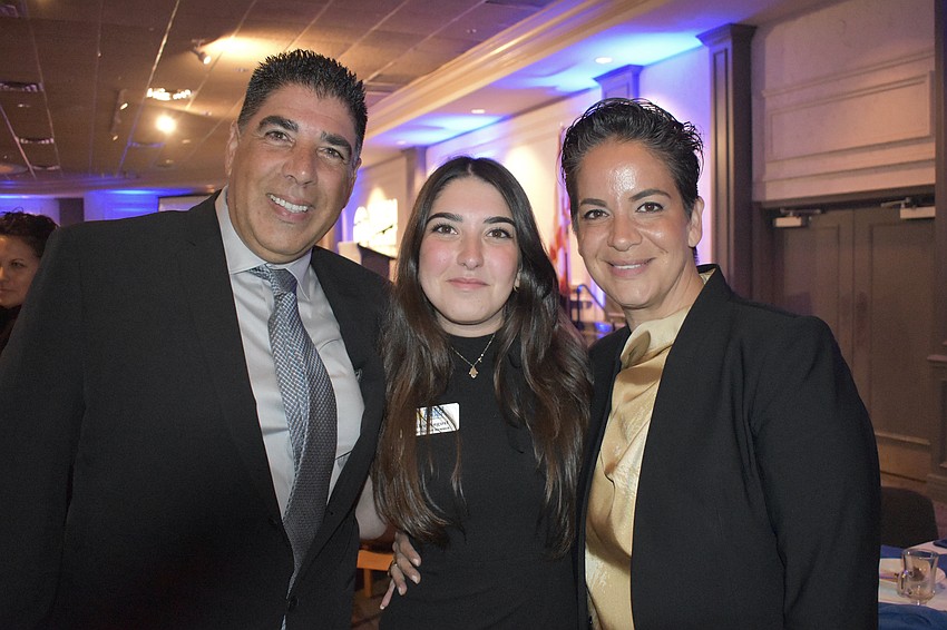 Tal August, his daughter Shailee August, a senior who was honored and her mother, Inbal August, right.