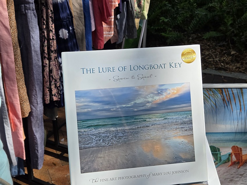 Artist Mary Lou Johnson had her book, The Lure of Longboat Key, on display at Le Marche Marketplace on Saturday.
