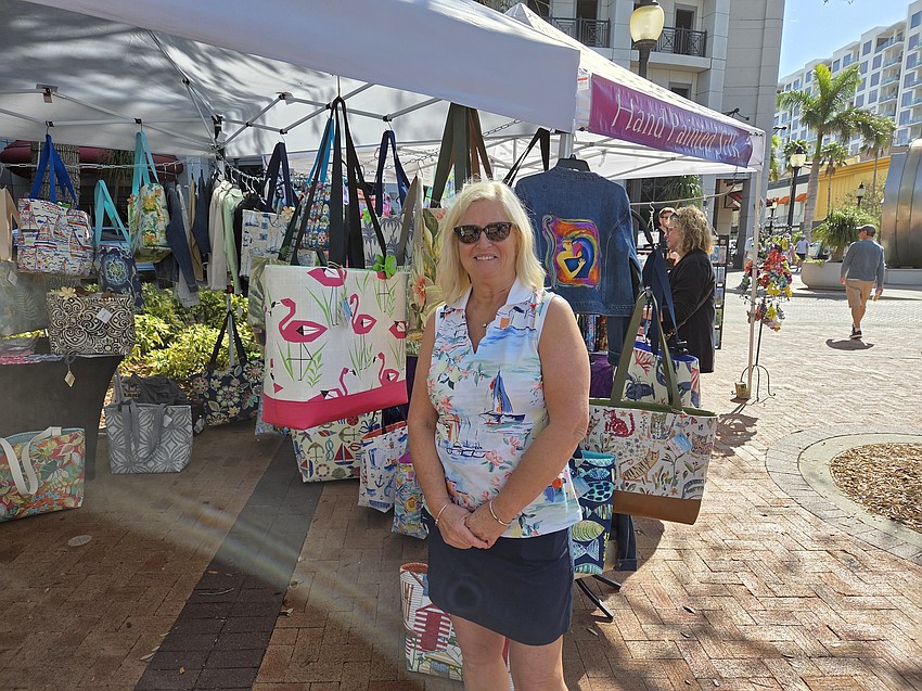 Dana Heppe of Dana Heppe bags displays her items at Le Marche Marketplace Saturday at Selby Five Points Park.