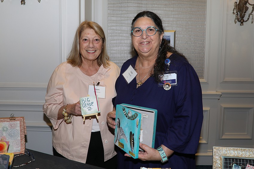 Providing art therapy for grief are Pam DeNobile and art therapist Lore Caldwell.