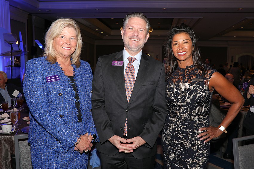 Tidewell Foundation President Delesa Morris with Empath Health President and CEO Jonathan Fleece and Clara Ramos