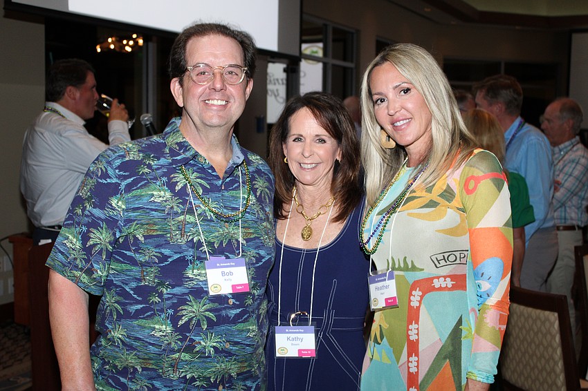 New board members Bob Kelly, Heather Herr and Kathy Beam join the annual St. Armands Residents Association dinner.