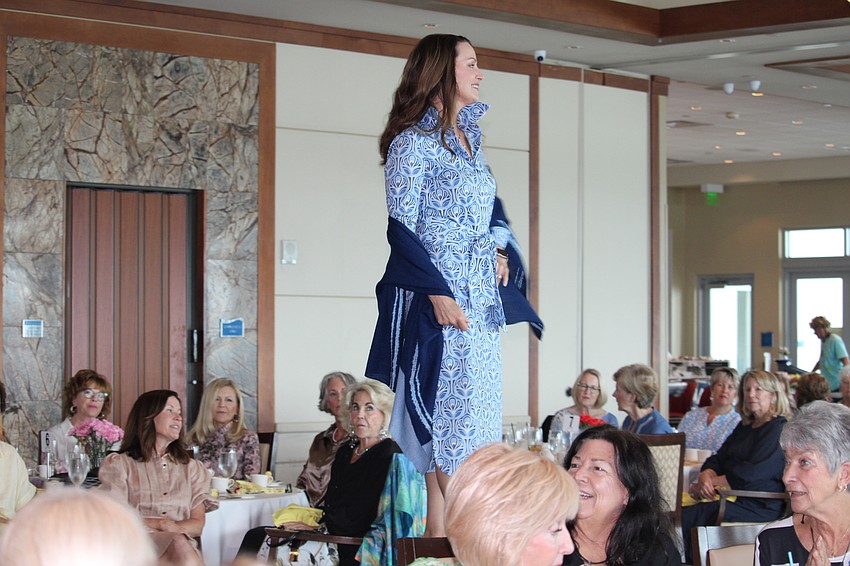 Fashion show co-chair Debbie Ehret models the orla dress in ogee bloom.