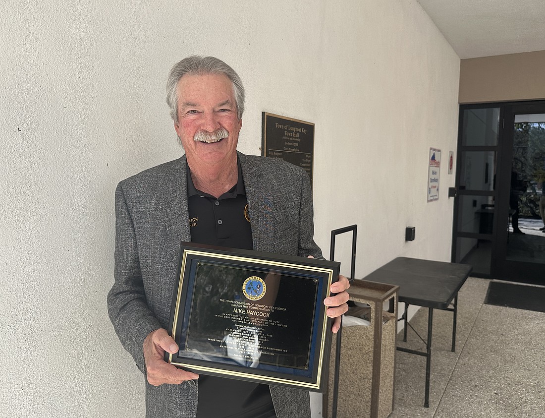 The town of Longboat Key honored Vice Mayor Mike Haycock with a plaque to celebrate his nine years of service to the town.