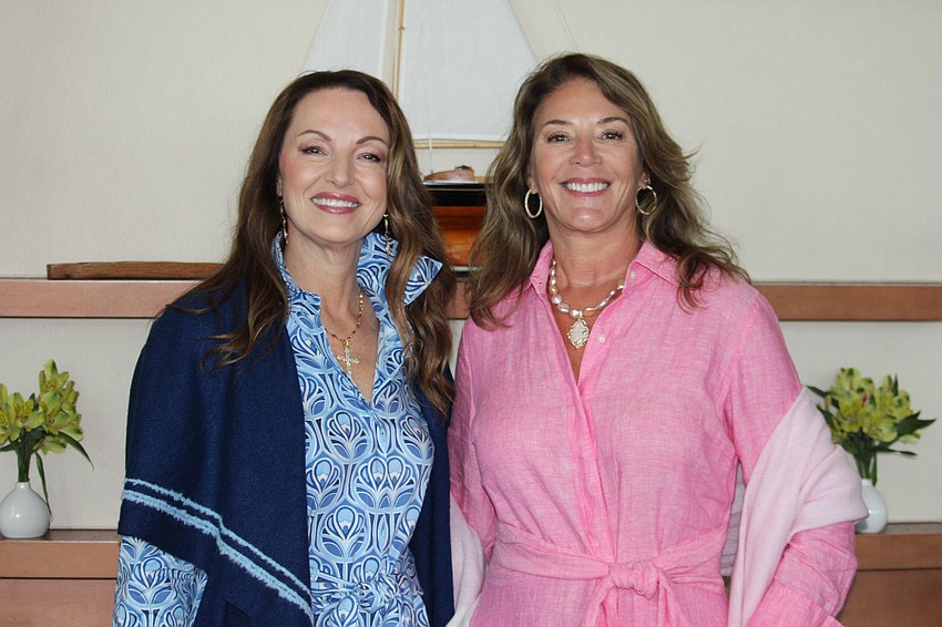 Fashion show co-chairs Debbie Ehret and Kathi Shamlian, modeling items supplied by North Star Jewelry, celebrated cute cupcakes and carnations at this year's showcase.