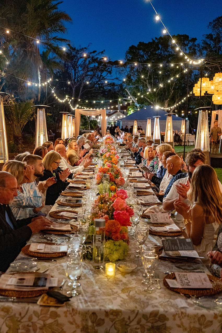 Guests sit down for Garden to Plate Wine Dinner at Marie Selby Botanical Gardens.
