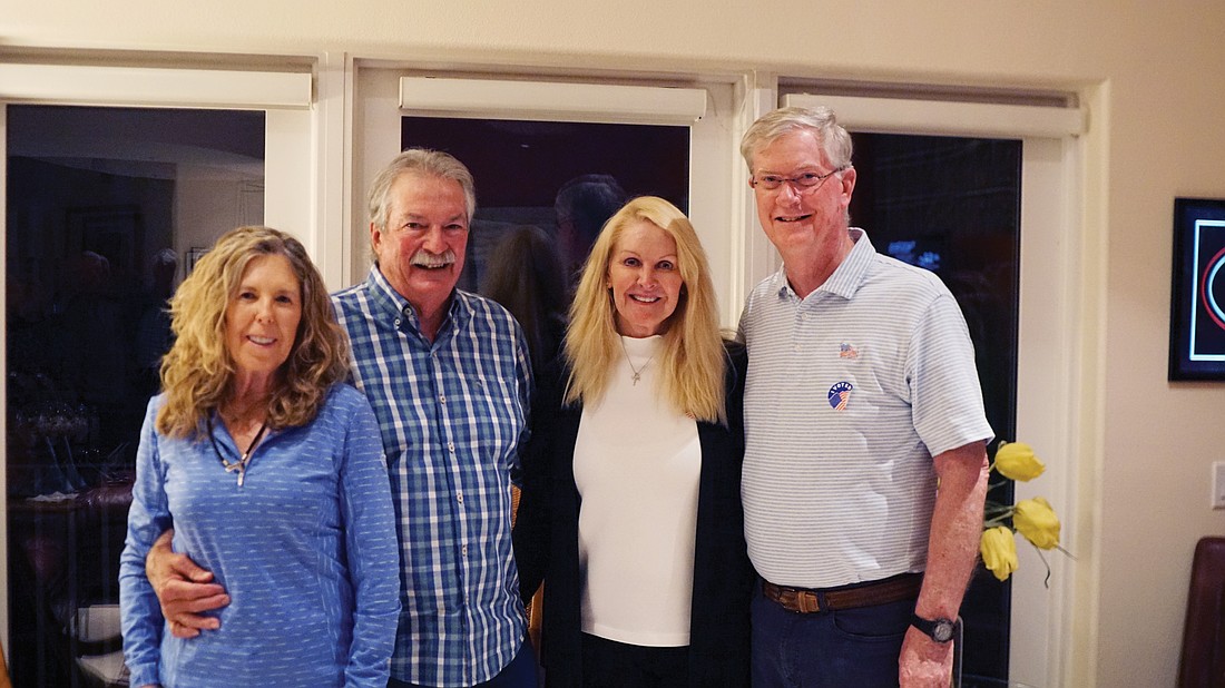 Lyn Haycock, Mike Haycock, Susan Phillips and Steve Branham celebrate Branham's win at his home on March 11. Branham will take over the at-large seat currently held by Mike Haycock.