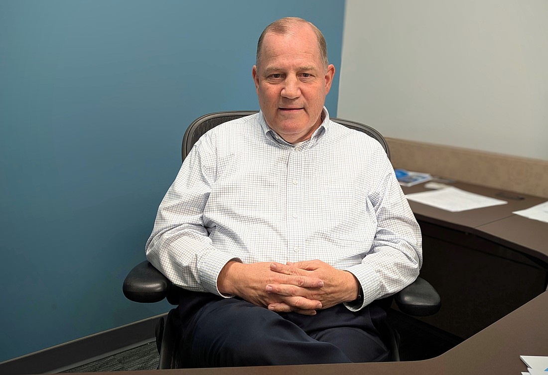 John Phillips, the new president of the Palm Coast-Flagler Regional Chamber of Commerce, in his new office. Photo by Brent Woronoff