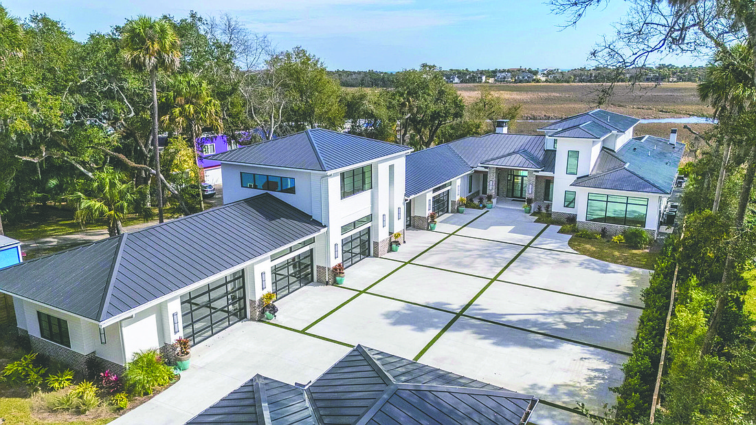 New Guana Preserve frontage home features seven bedrooms, seven full and one half-bathrooms, porches, pool, outdoor kitchen and guesthouse.