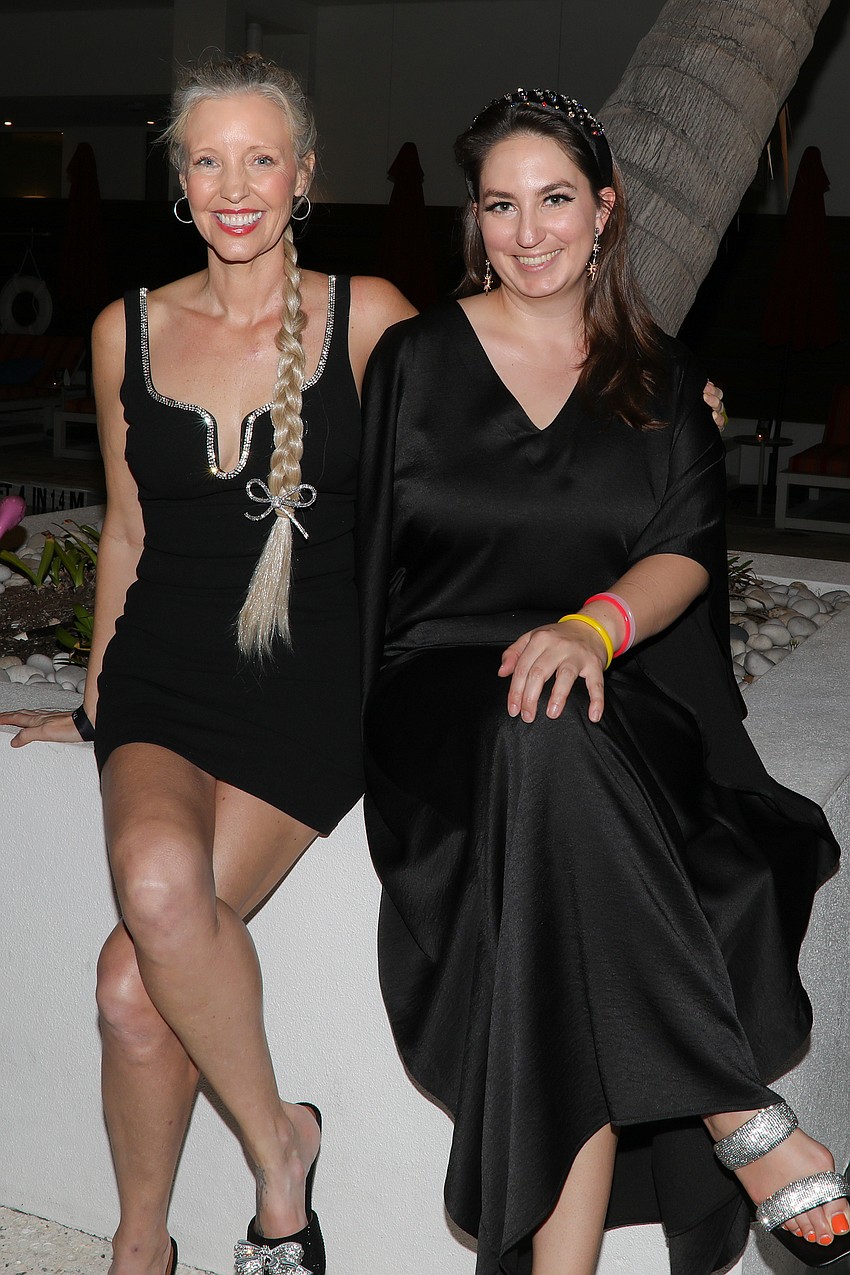 Summer Wallace and Alexa Evans enjoy the Black Party held by the Urbanite Theatre on March 8 at the Sarasota Modern Hotel.