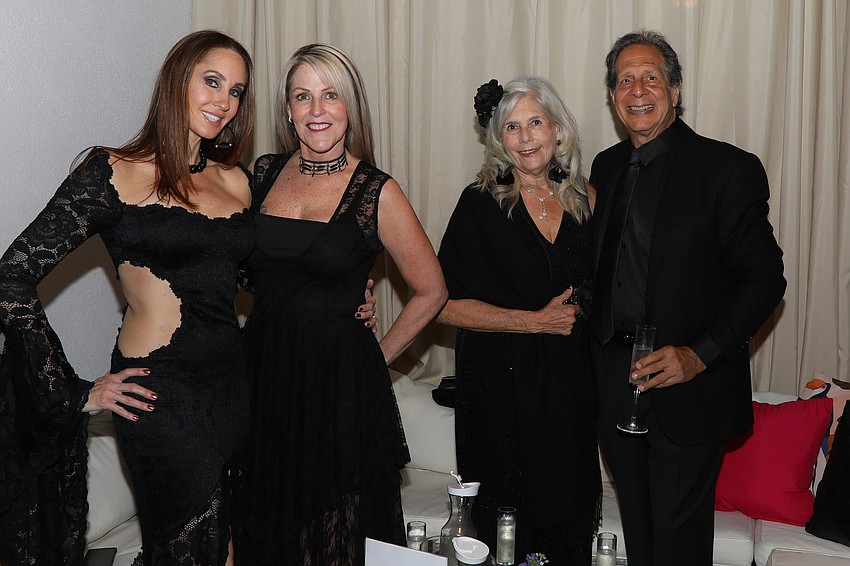 Jaime Still, Lori Knight, Marty Betagole and Dennis Klein take over a cabana at the Urbanite Black Party on March 8.