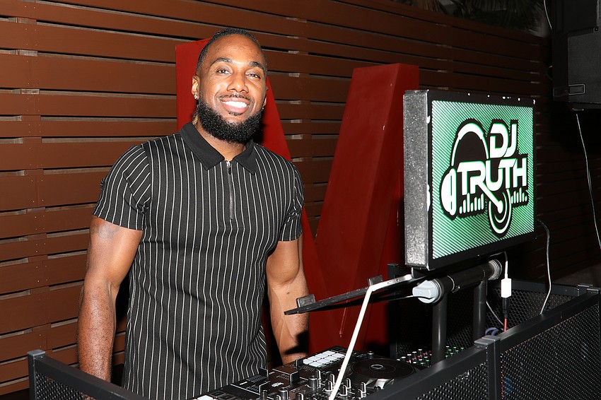 Ronnie Powell, aka DJ Truth, spins dance songs all night long.
