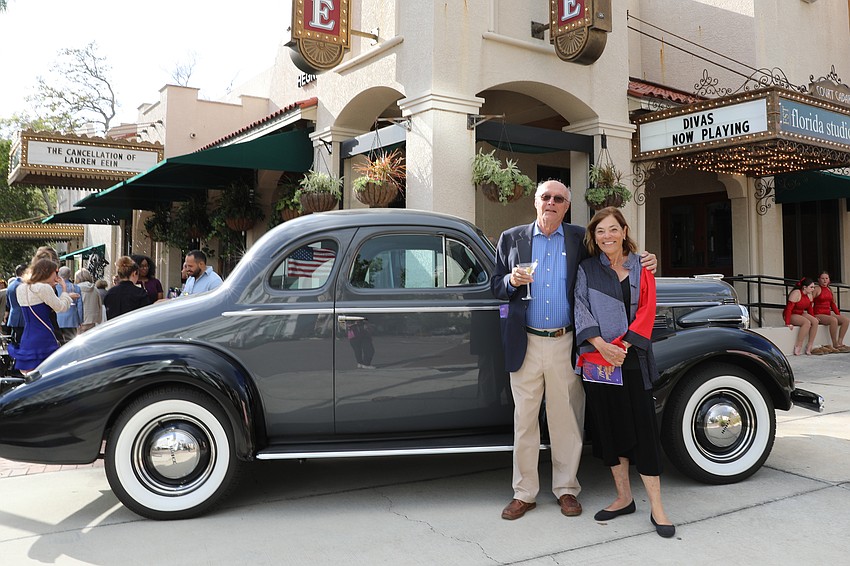 Alex Huppe and Jeryl Schriever pose with Huppe's 1937 Buick Special in front of Florida Studio Theatre.