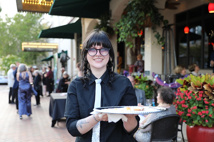 Sarah Garrett serves appetizers.