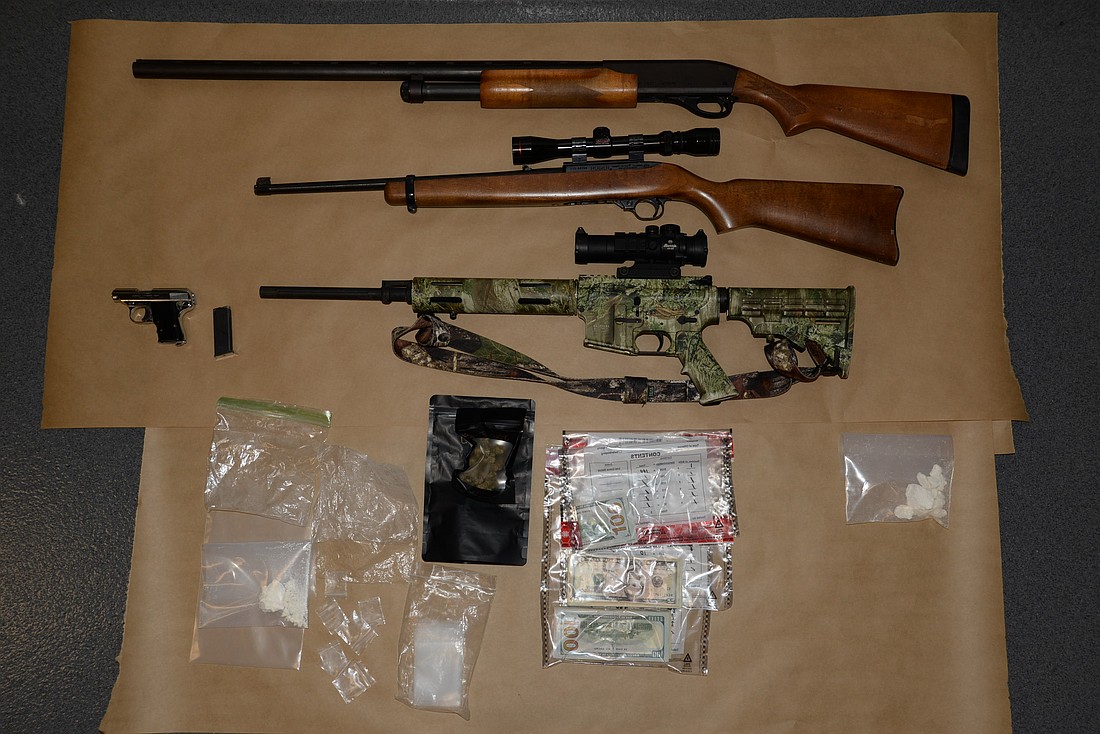 Detectives seized 47 grams of cocaine, over $1,000 in cash, as well as cannabis, drug paraphernalia and four firearms. Courtesy photo