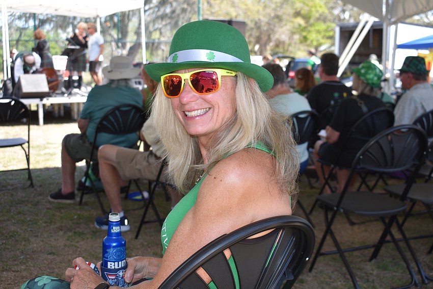 Bradenton's Mary Quinn settles in to watch the Blue Skye Pipes and Drums band.