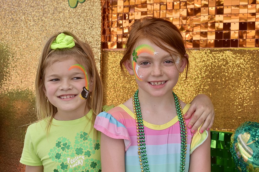 Lakewood Ranch's 6-year-old Ansley Cleveland and 7-year-old Savannah Cato are feeling Irish after having their faces painted.