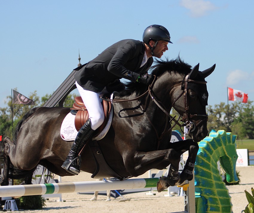 David Blake of Ireland holds J. Diago tight as they clear a hurdle at TerraNova.