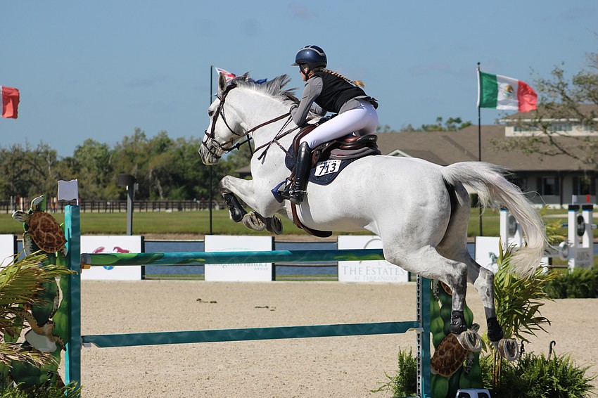Maggie Jacobs of the U.S. and Fury clear a hurdle on Saturday at TerraNova.