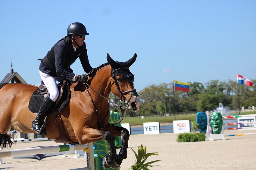 Paul O'Shea of Ireland and Spy take a jump in the Split Rock Jumping Tour Finale on Saturday. The pair won the title.