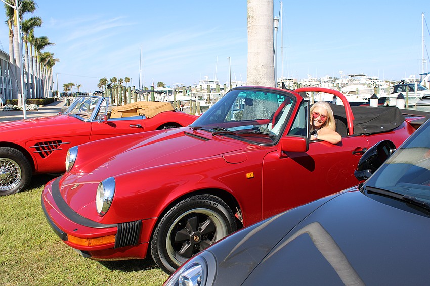 Renae Fjugstad smiles from the drivers seat of her 1984 Porsche 911 Carrera Cabriolet.