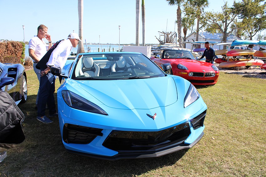 Club members check out a 2023 Chevrolet Corvette.
