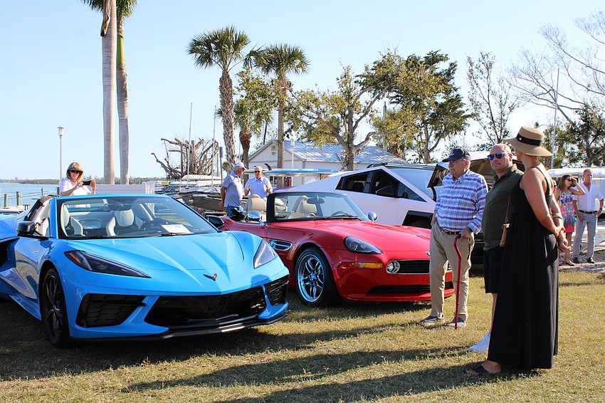 YachtRodders members peruse the cars at the spring showcase.
