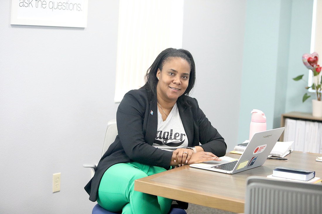 Flagler Schools Superintendent LaShakia Moore working in her office on St. Patrick's Day. Photo by Brent Woronoff