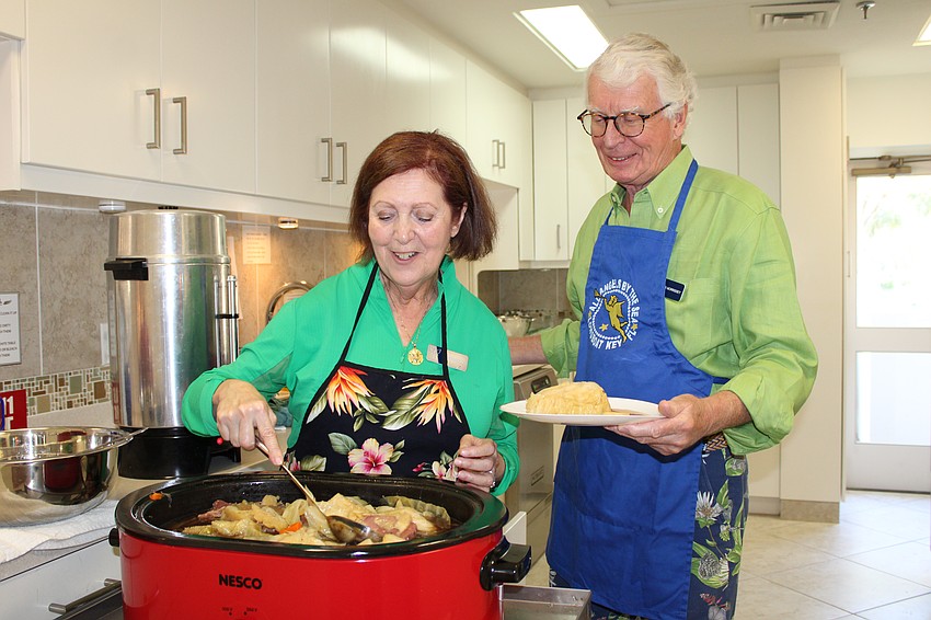Jinx Kochan dishes up Irish stew with Bob Morissey at All Angels by the Sea Episcopal Church's Saint Patrick's Day dinner and concert on March 17.