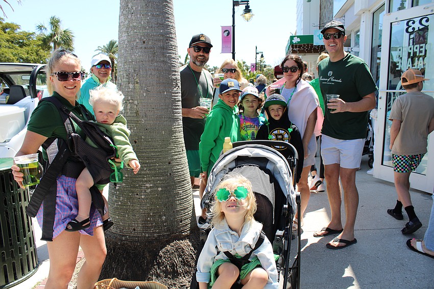 The Noble family, visiting Longboat Key relatives all the way from Canada, offers a cheers on St. Patrick's Day.