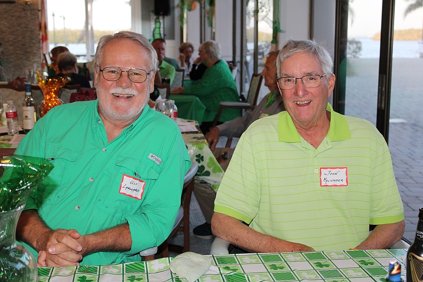 Ulf Langgard and John Macumber don their best green duds for St. Patrick's Day at Longboat Harbour Condominiums.