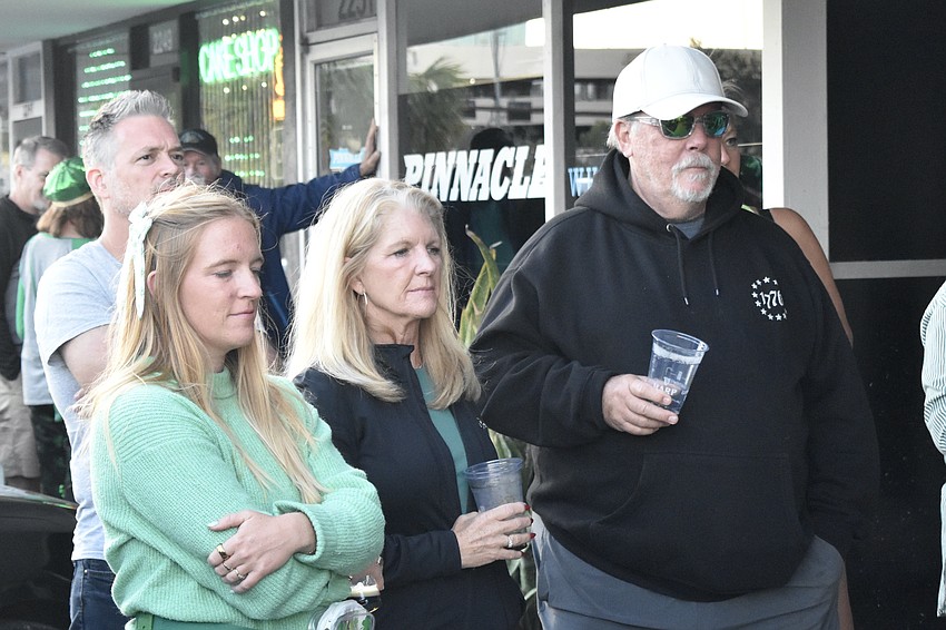 Jane Early watches the dancers with her parents Libby Howe and Kent Early.