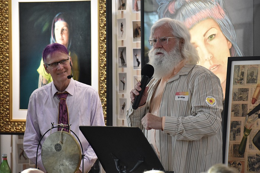 Paul Sykes watches as Bubba Henson performs a poetry recitation.