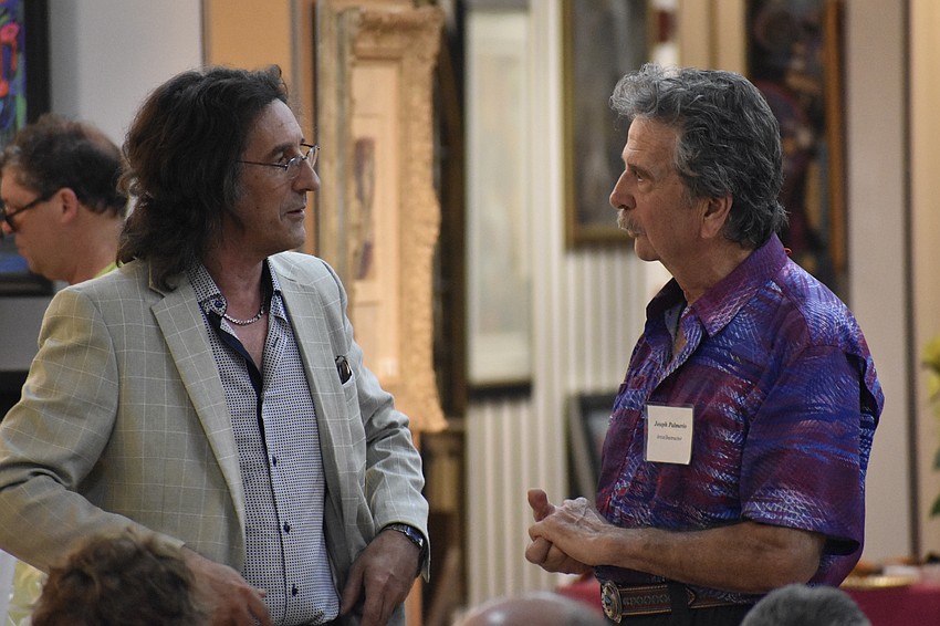 Artist Phil Crawford talks with artist Joseph Palmerio