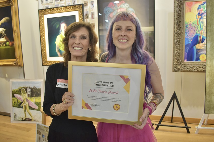 Leslie Travis Howell received the Best Mom in the Universe award from Megan Howell.
