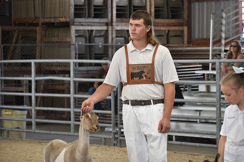Wyatt Johnston of the senior level holds Bubbles.