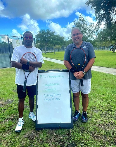 Anthony Truong (right) suffered a cardiac arrest in February. His life was saved thanks to quick action from teammates and spectators. He is pictured here alongside teammate Steve McGary (left) during a previous championship match. Courtesy photo