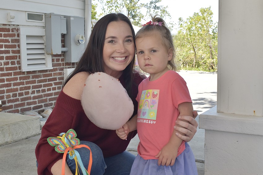 Shelley Johnson and her daughter Nora Johnson, 2, come away from Twisted Sugar ConfectionAIRy with cotton candy.