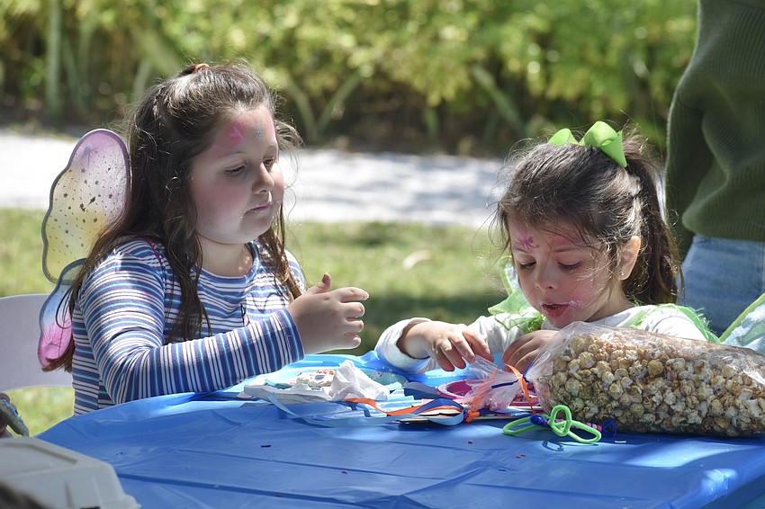 McKenzie Galvan, 8, and her sister Margaret Galvan, 4, enjoy cookies they've decorated.