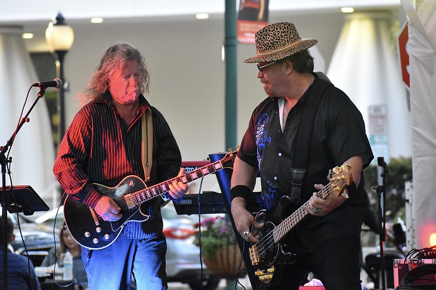 Kurt Kiehnle and Larry Kirby of the band Jack'd Up play off of each other's energy.