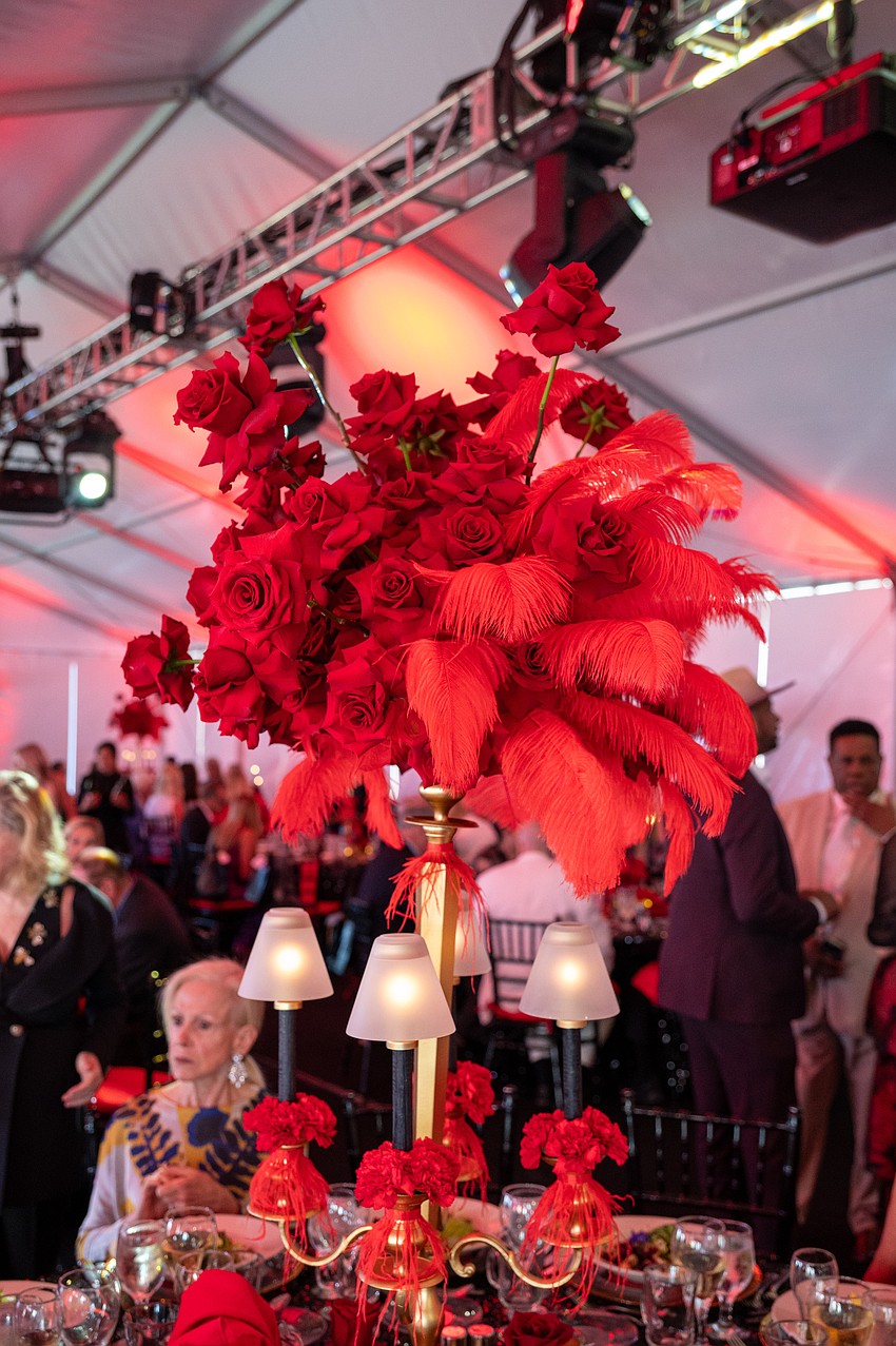 The centerpieces reflected the Moulin Rouge theme.