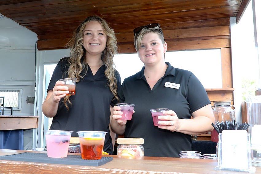 Erika Cornwell serves drinks with Coastal Cocktail owner Kelli McDermott who saw a need for a mobile bar.