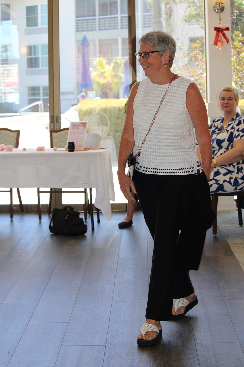 Linda Herrick displays a black-and-white ensemble.