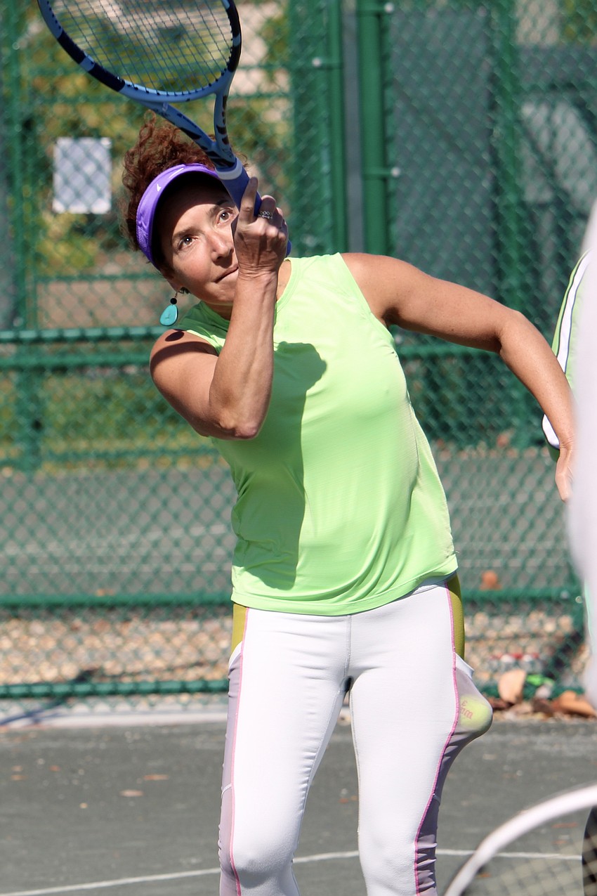 Felice Marcus serves at the Friends of Tennis women's party at the end of the season.